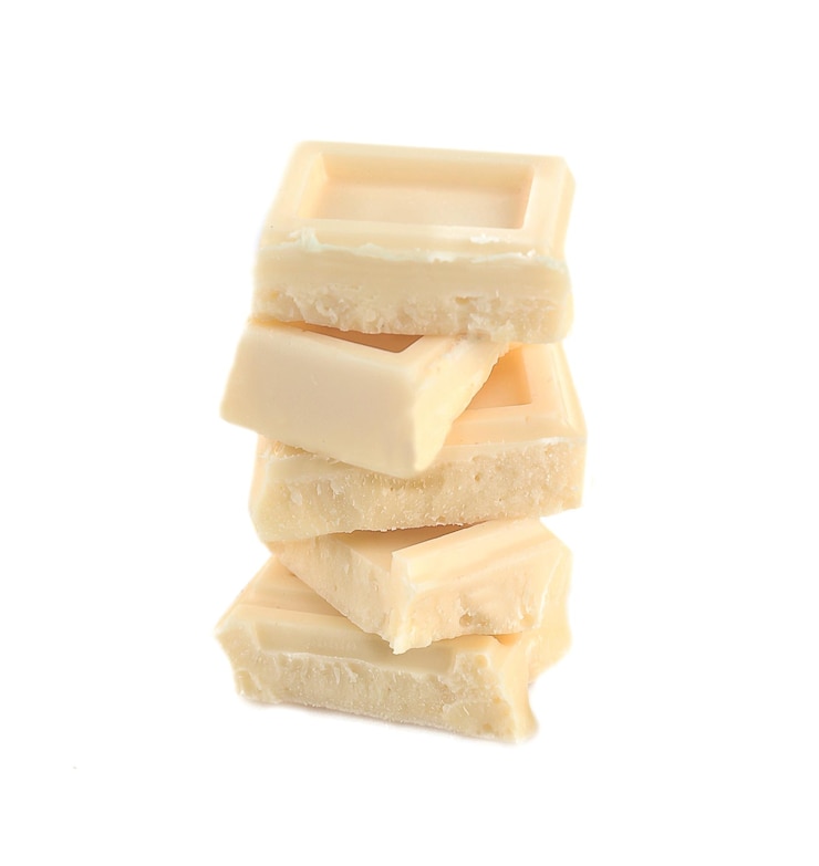 Photo carreaux de chocolat blanc isolés sur blanc