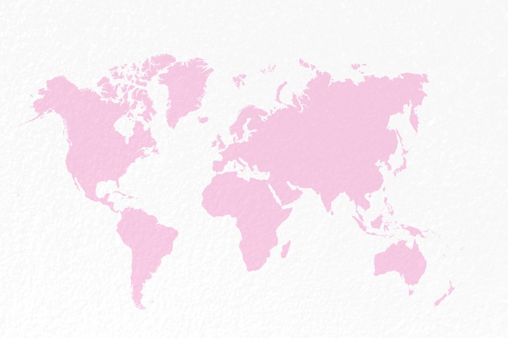 Photo carte du monde sur fond rose pastel