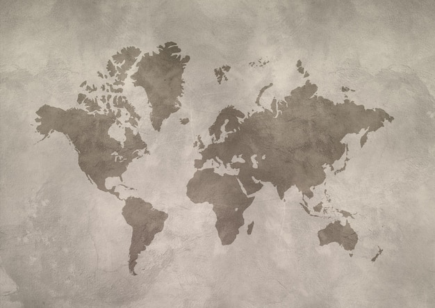 Photo carte du monde isolée sur mur de béton