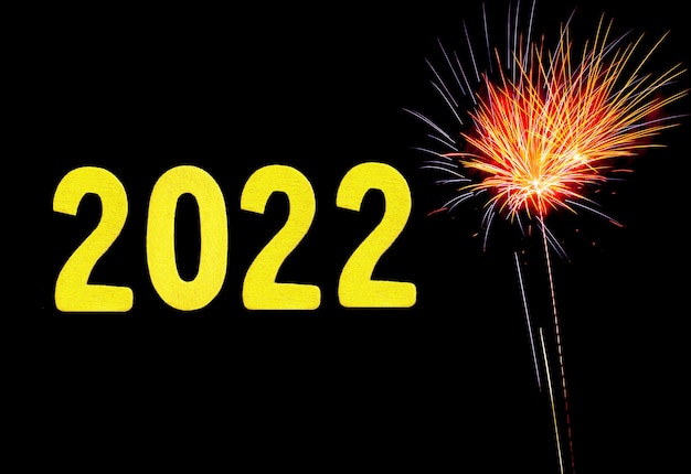 Carte De Nouvel An Pour 2022 Avec Chiffres En Or Sur Fond De Feu D'artifice.