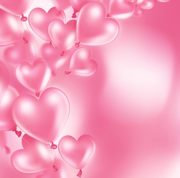 Carte romantique avec des ballons roses en forme de coeur