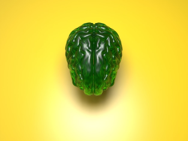 Cerveau de cristal vert sur surface jaune