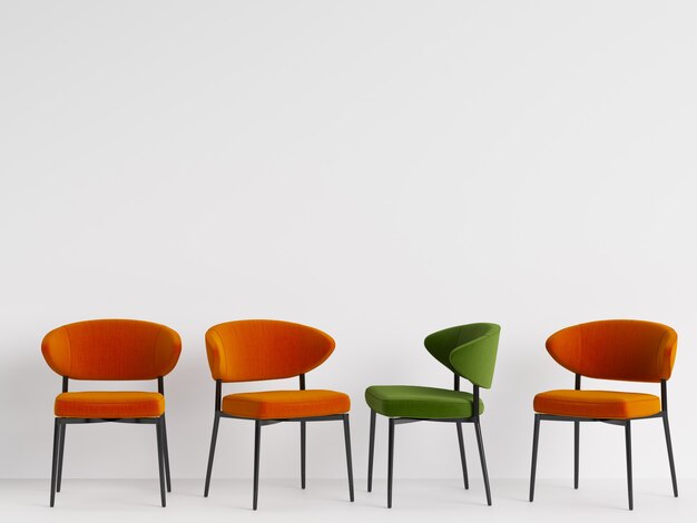 Une chaise verte parmi des chaises orange sur mur blanc. Concept de minimalisme. Rendu 3D