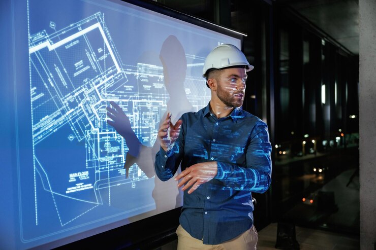 Photo chapeau de protection sur la tête l'architecte en chapeau est près du projecteur avec le plan de construction