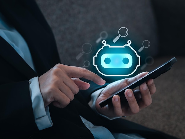 Chat GPT et AI recherche par concepts de technologie d'intelligence artificielle L'icône du robot intelligent Chatbot apparaît sur le téléphone mobile intelligent tandis que l'homme d'affaires détient et utilise pour le service d'assistant