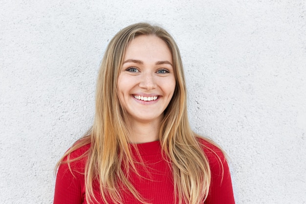 Cheerful blonde woman with rousseur face