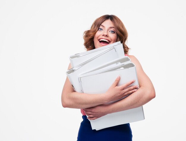 Cheerful businesswoman holding dossiers