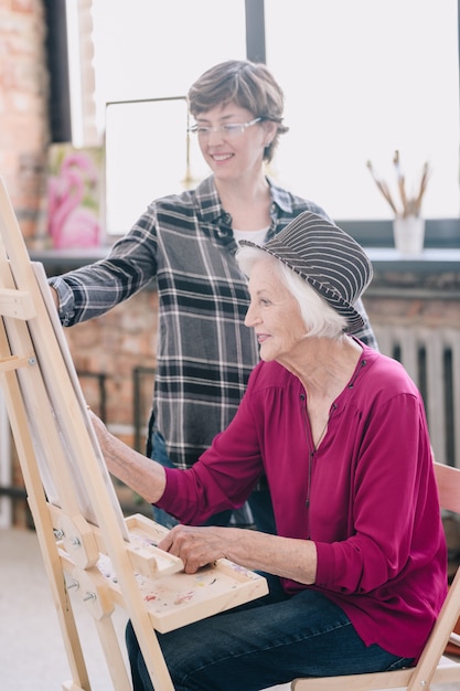 Cheerful Senior Woman in Art Class