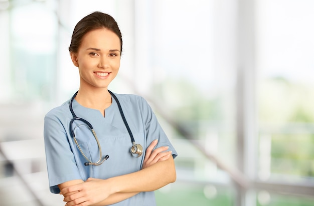 Cheerful Young Nurse in Blue Scrubs