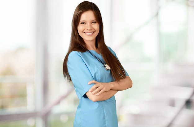 Cheerful Young Nurse in Blue Scrubs