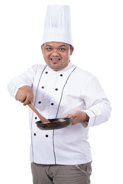 chef cuisinier avec holding pan et spatule
