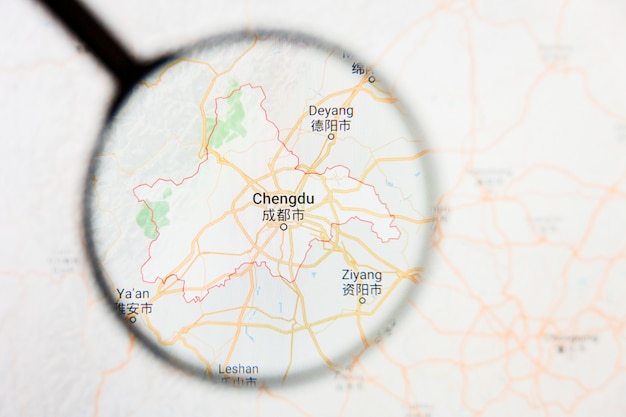 Photo chengdu, chine concept illustratif de visualisation de la ville sur l'écran d'affichage à travers la loupe