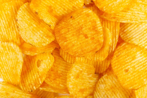 Chips de pommes de terre croustillantes close up snack texture background