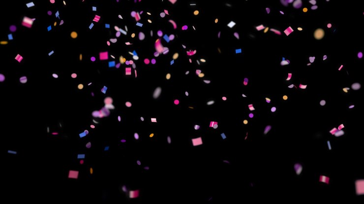 Photo chute de confettis multicolores sur fond noir