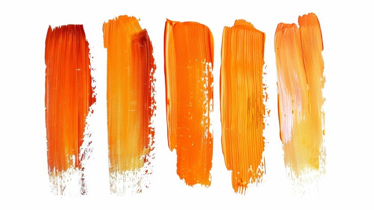 Photo cinq nuances différentes de peinture orange, chacune avec une texture unique.