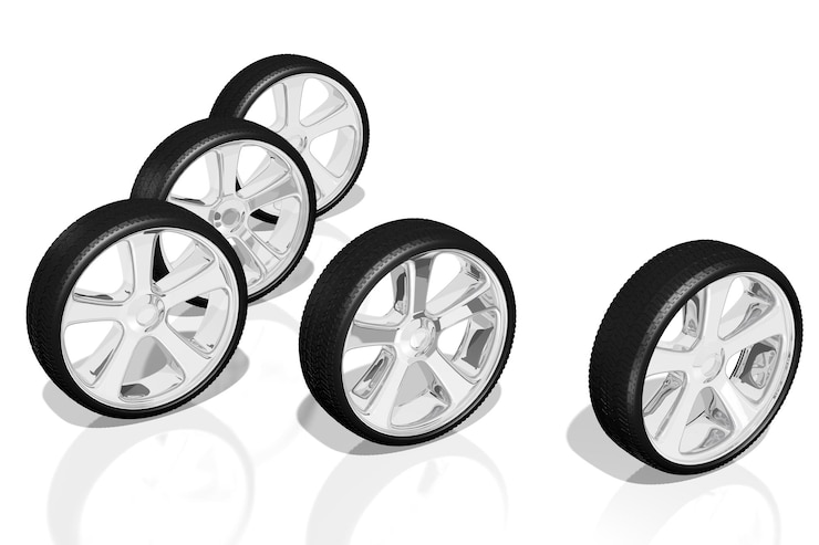 Photo cinq roues de voiture sur fond blanc illustration 3d