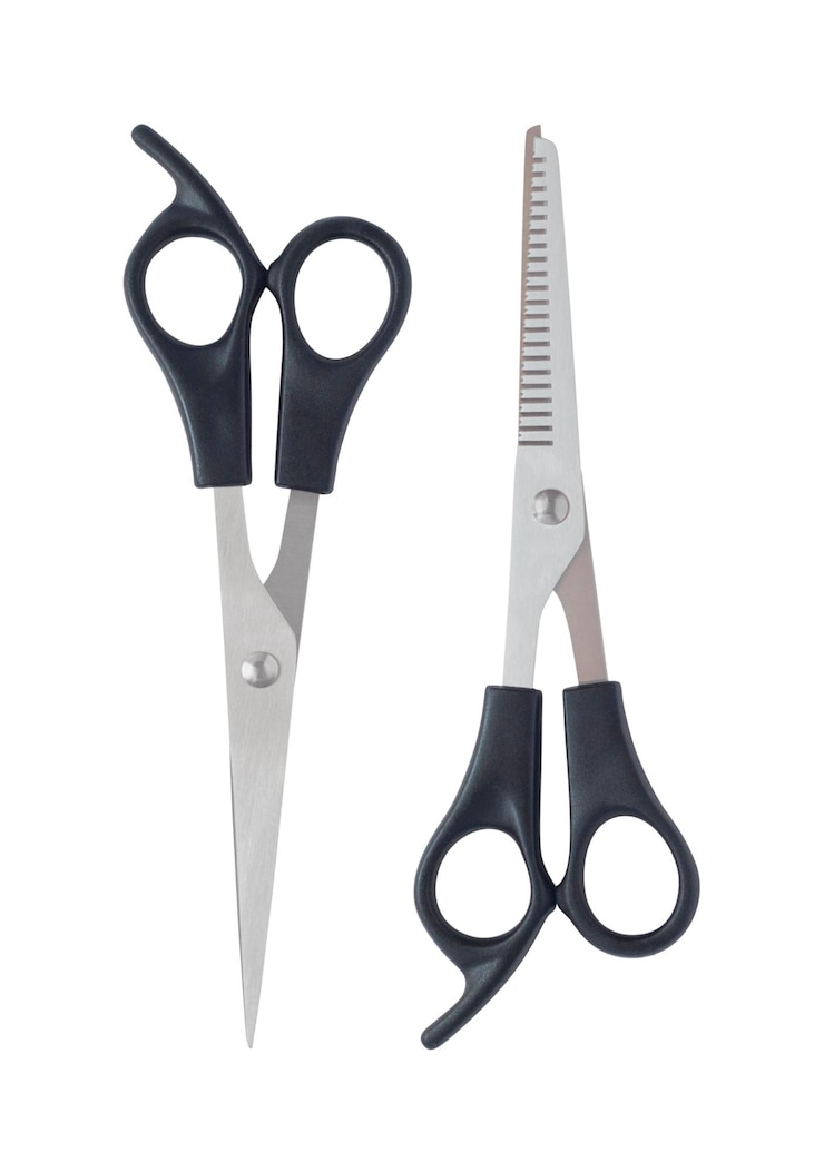 Photo ciseaux professionnels de coiffure et d'amincissement isolés sur fond blanc