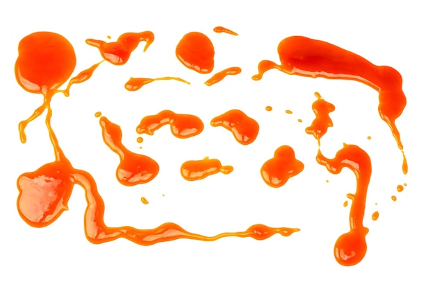 Éclaboussures de sauce orange isolés sur fond blanc Vue de dessus