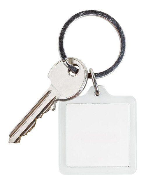 Photo une clé de serrure à cylindre et un porte-clés carré sur anneau