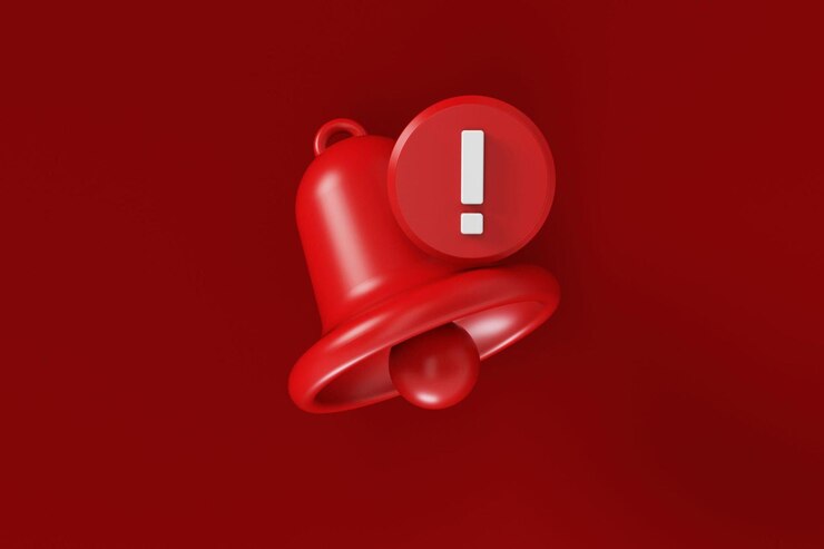 Photo cloche de notification rouge et point d'exclamation sur fond rouge