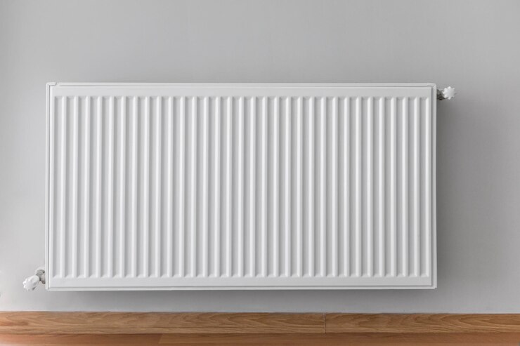 Photo close-up du radiateur contre le mur à la maison