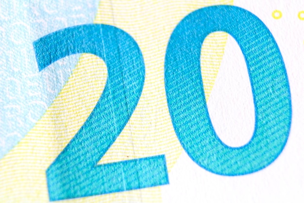 Photo close-up d'un fragment de billet de 20 euros sur le revers montrant le numéro de dénomination 20