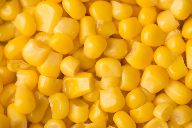 Photo close-up haut au-dessus de voir la photo de fond texturé de maïs en conserve jaune vif