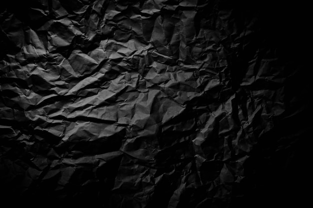 Close up of black ride froissé vieux avec fond de page papier texture rugueux.