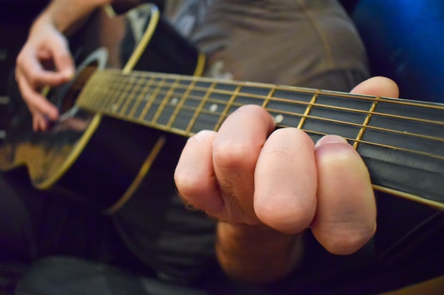 Close Up of Guitarist Playing Guitar Acoustic