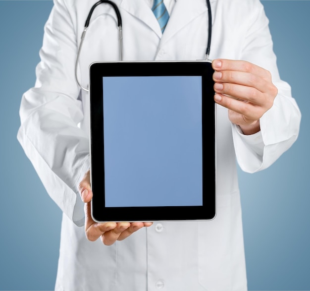 Close up of male doctor holding tablet pc avec x-ray