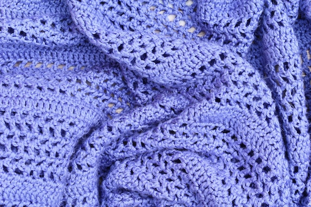 Close up plaid tricoté à la main bleu chaud