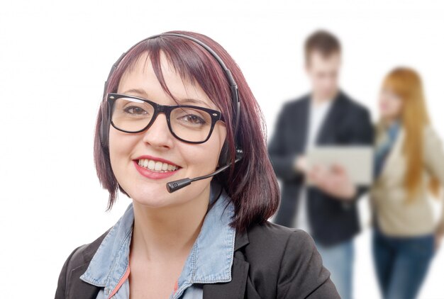 Close-up portrait of smiling young woman with headset