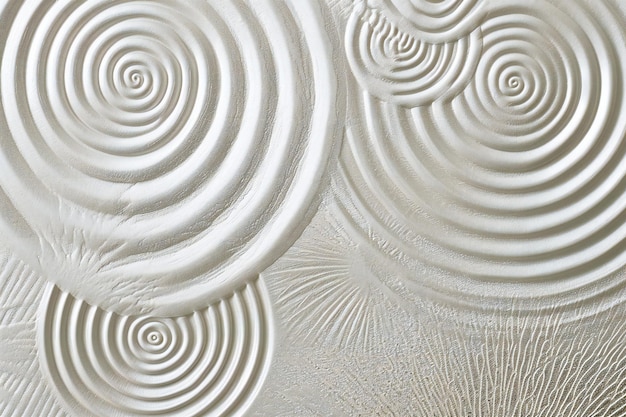 Photo close-up d'une texture de mur blanc avec des cercles concentriques