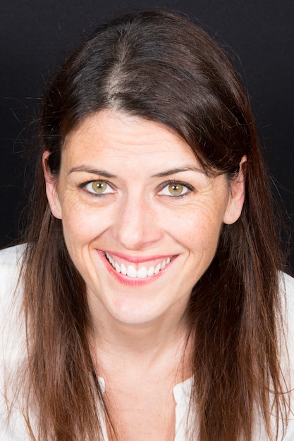 Closeup portrait of a happy young woman smiling