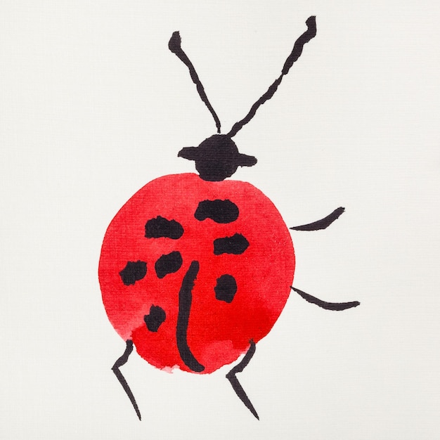 Photo coccinelle dessinée par des aquarelles rouges et noires