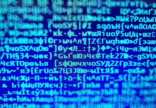 Code de hacker bleu sur fond de bokeh de la console d'affichage