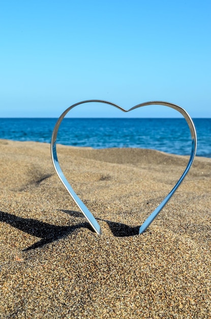 Le cœur sur la plage de sable