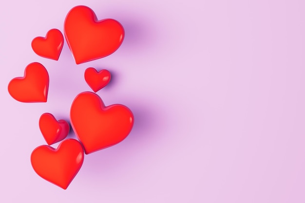 Coeurs rouges pour la saint valentin sur fond rose