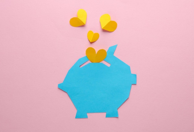 Coffre-fort découpé en papier avec des cœurs sur un fond rose Concept d'amour d'affaires mise en page créative