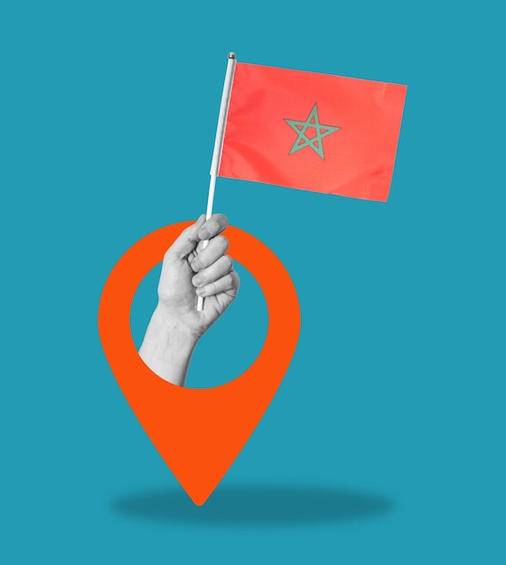 Collage artistique de la main avec le drapeau marocain sur fond bleu avec signe de navigation