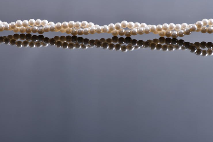 Photo collier de perles fond de perles beau bijou
