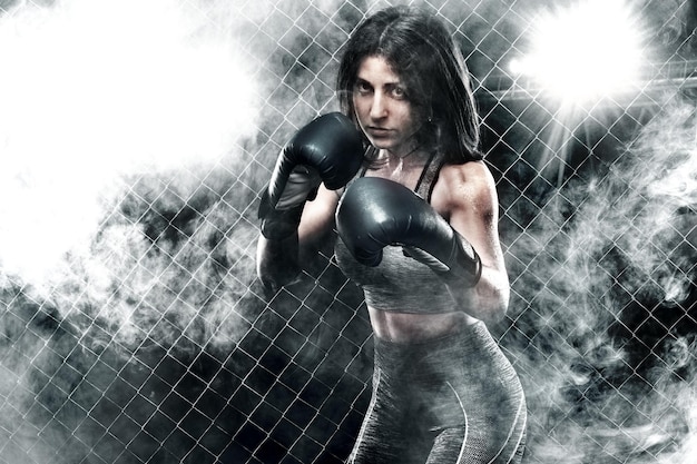 Photo combattant brutal boxeur femme close up sport concept