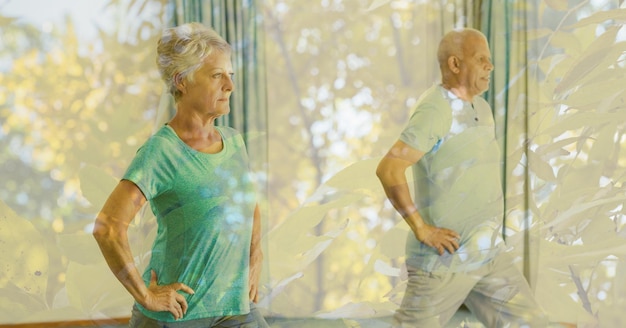 Composition d'un couple de personnes âgées pratiquant le yoga et le feuillage d'automne