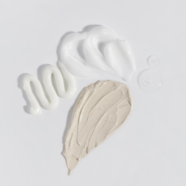 Composition de diverses crèmes, sérums et frottis de masque Texture beauté Échantillon d'un produit cosmétique