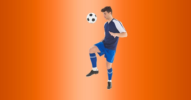 Composition d'un joueur de football masculin frappant le ballon avec espace de copie