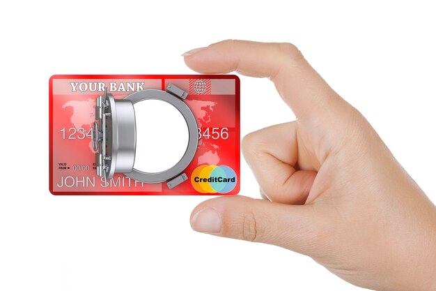 Concept de banque en ligne sécurisé. Closeup Woman Hand Hold Carte de crédit avec porte de coffre-fort bancaire sur un fond blanc.