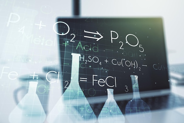 Photo concept de chimie créative sur fond d'ordinateur portable moderne