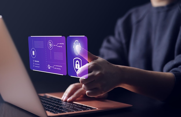 Concept de cybersécurité Utilisateur se connecte pour accéder à un ordinateur portable Identification biométrique empreintes digitales nom d'utilisateur et mot de passe Authentification de l'utilisateur Système d'information Sécurité chiffrement confidentiel