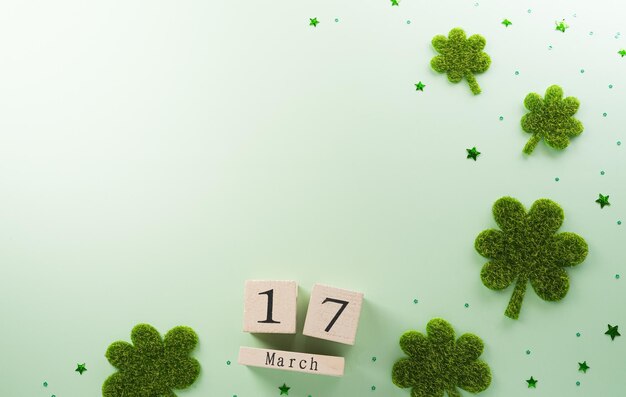 Photo un concept de décoration pour la fête de saint-patrick fait à partir de feuilles de trèfle et d'un calendrier en bois