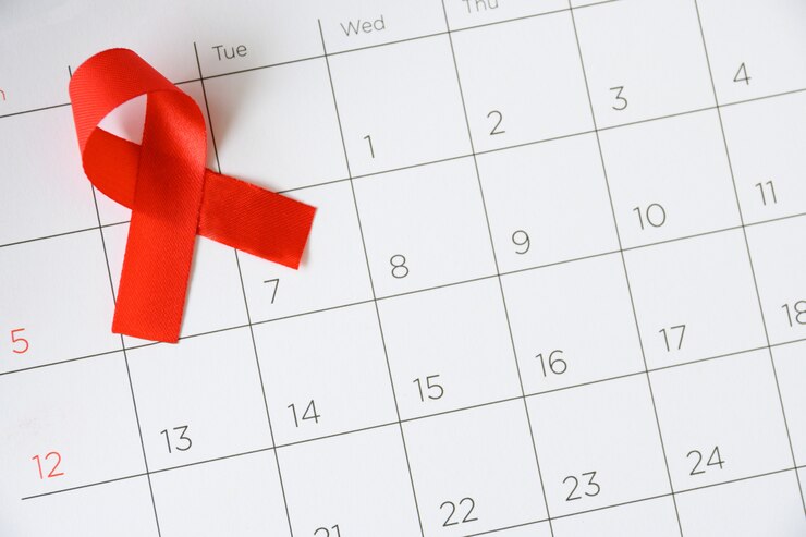 Concept de la journée mondiale du sida, ruban rouge la date du 1er décembre